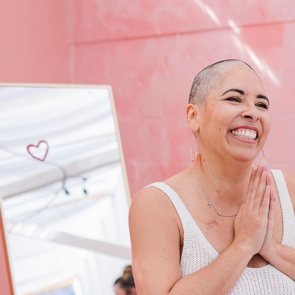 Rebekah getting her head shaved after breast cancer diagnosis.