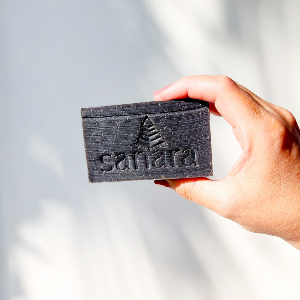 Black Brazilian Clay Soap Bar Full Size in Hand